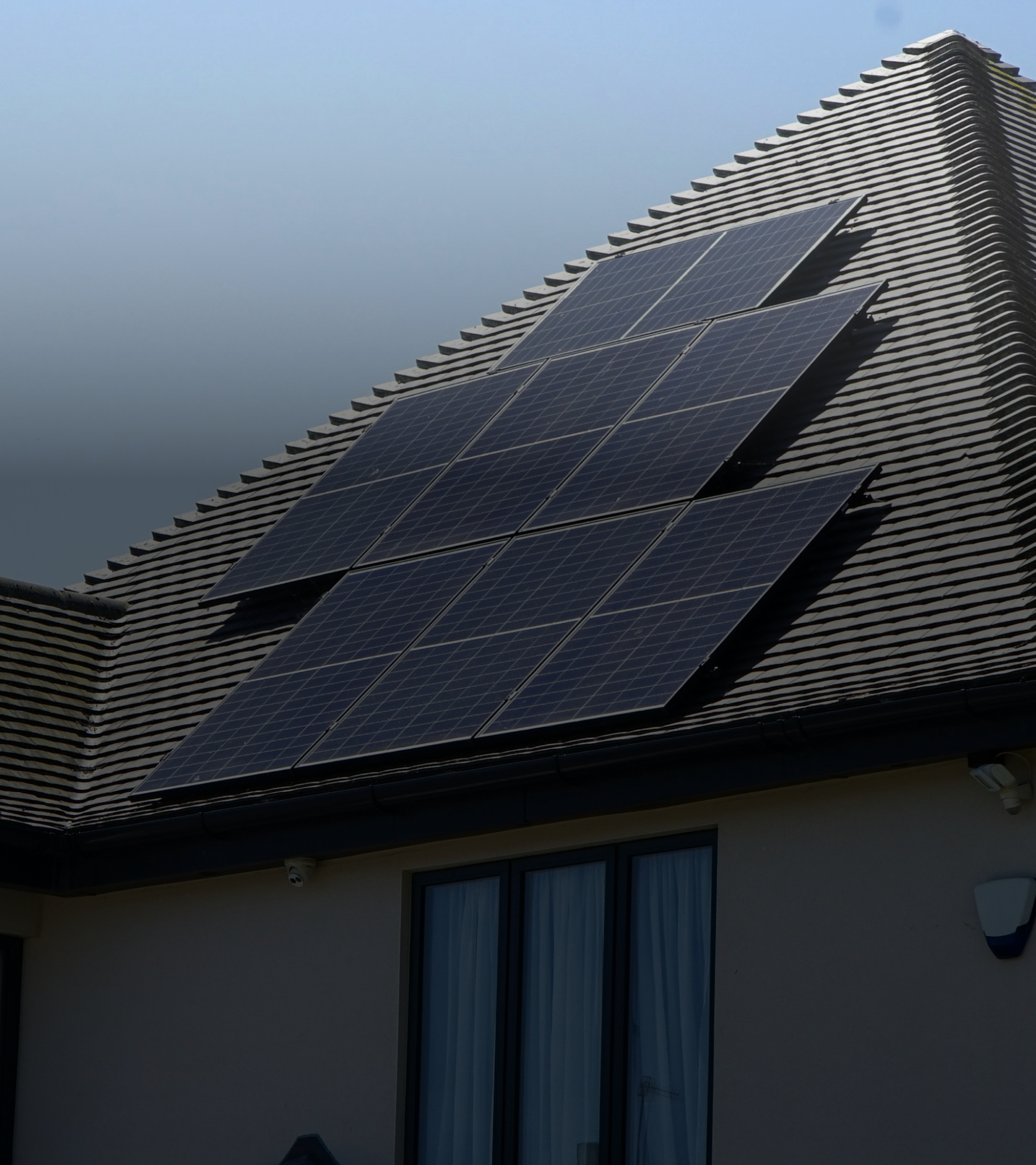 Solar panels on a roof during sunset